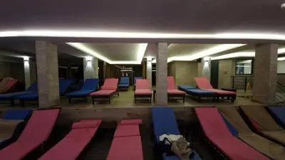 a room with purple and pink chairs and a row at G4 Apartment Milmari in Kopaonik