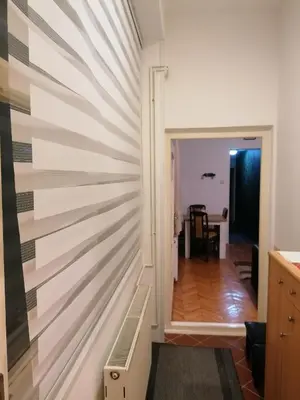 a wall made out of strips of wood at Apartman Centar in Kruševac