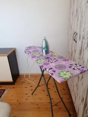 a purple table with a phone sitting on top of it at Apartman Centar in Kruševac