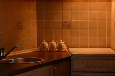a kitchen with a sink and a counter top at Love Apartment in Vrnjačka Banja