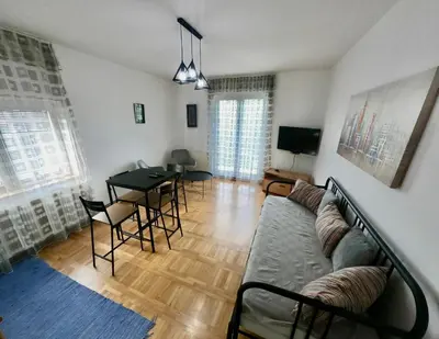 a living room with a couch and a table at Filip Apartments in Soko Banja
