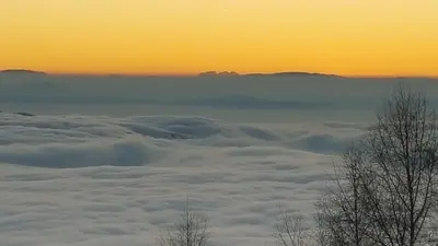a view from above the clouds at sunset at Holiday Home Floris in Kopaonik