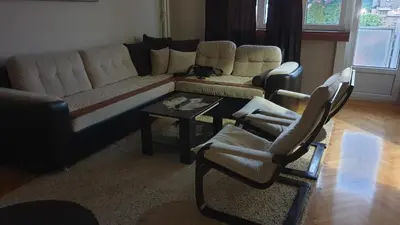 a living room with a couch and two chairs at Apartman Sweet dreams 1 in Niš