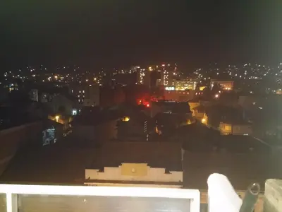 a view of a city at night at Apartman Sweet dreams 1 in Niš