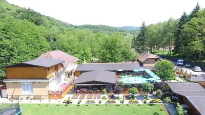 an aerial view of a resort with a swimming pool at Cuki Residence in Mala Ravna Reka