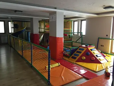 a room with a play area with a playground at Apartment Andrijana in Kopaonik