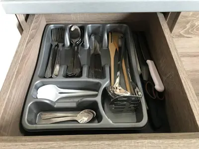 a tray filled with utensils in a drawer at Apartment Andrijana in Kopaonik