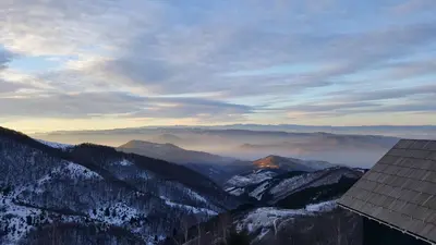 a view of a mountain range with snow covered mountains at Apartment Andrijana in Kopaonik