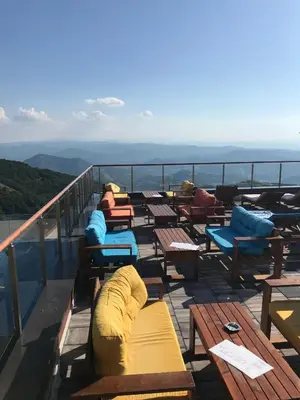 a group of benches on the top of a balcony at Apartment Andrijana in Kopaonik