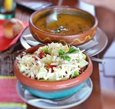 a bowl of soup and a bowl of food at Guest House Vila Horizont in Goč
