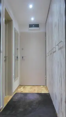 a hallway with a large door in a room at Apartments Vanja i Vrh in Kopaonik