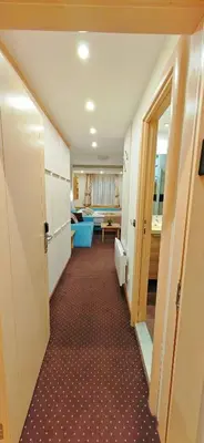 a hallway leading to a room with a living room at Apartments KOP Konaci in Kopaonik