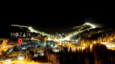 a view of a ski resort at night at Apartments Mozaik in Kopaonik
