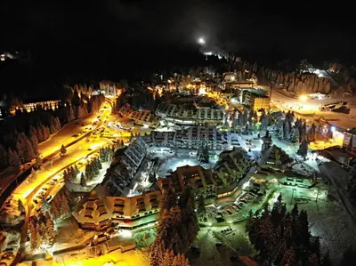 an aerial view of a city at night at Apartments Mozaik in Kopaonik