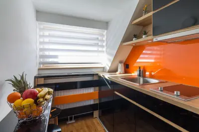 a kitchen with a bowl of fruit on a counter at Apartments Mozaik in Kopaonik