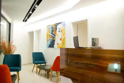 a room with chairs and a painting on the wall at Apel Luxury in Niš