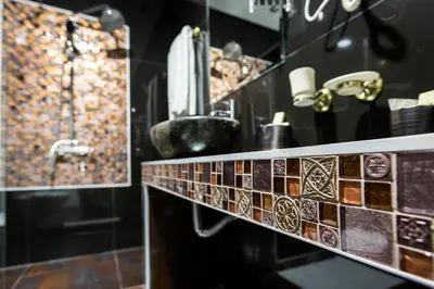 a bathroom with a sink and a shower at Hotel Crystal Light in Niš