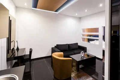 a living room with a couch and a table at Hotel Crystal Light in Niš