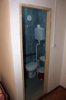 a small bathroom with a toilet and a sink at Stara Planina Vila Vesela kuca in Jalovik Izvor