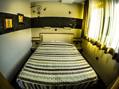 a small room with a bed in the corner at SM Apartments Kopaonik in Kopaonik