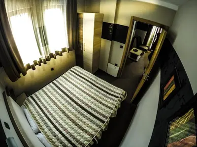 an overhead view of a bedroom with a bed and a window at SM Apartments Kopaonik in Kopaonik