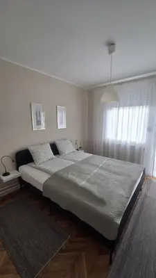 a bedroom with a large bed in a room at Apartman Rada in Pirot