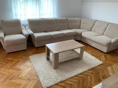 a living room with a couch and a coffee table at Pansion 