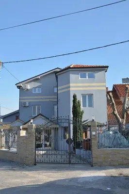 a house with a gate in front of it at Prenociste Bojan 017 in Vranje