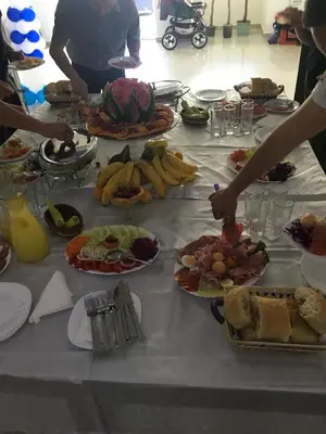 a table with many plates of food on it at Prenociste Bojan 017 in Vranje