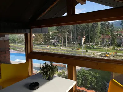 a window in a house looking out at a park at Apartments Park 2016 in Surdulica