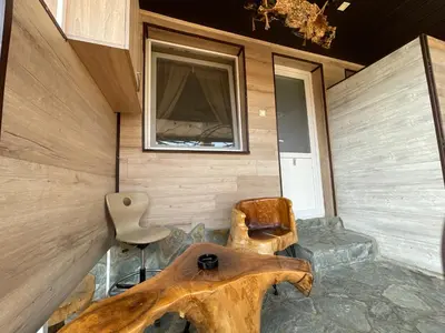 a room with a table and two chairs and a window at Apartments Park 2016 in Surdulica