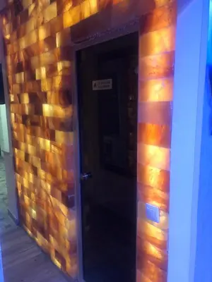 a door in a brick wall with a sign on it at Apartment Elvir in Kopaonik