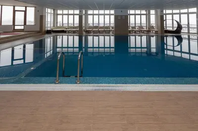 a large swimming pool in a building at Apartment Milmari Sunny View G3 in Kopaonik