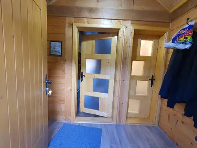 a small room with a door in a cabin at Vila Dizdarevic Kopaonik in Kopaonik