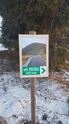 a sign on the side of a road in the snow at Vila Dizdarevic Kopaonik in Kopaonik