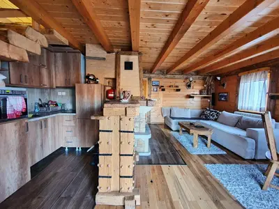 a living room with a couch and a table at Vila Dizdarevic Kopaonik in Kopaonik