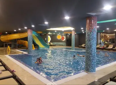 a group of people in a swimming pool at Sunny Kop Čardaci in Kopaonik