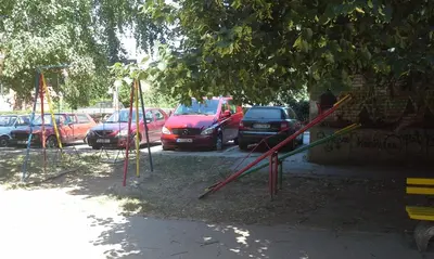 a group of cars parked in a parking lot at Studio Ema in Niš