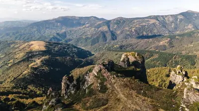 a view of the mountains from the top of a mountain at Lodge Zeleni svet in Crni Vrh