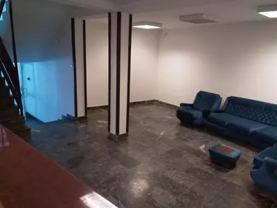 a waiting room with a couch and a chair at KOPAONIK-GONDOLA 100m in Brzeće