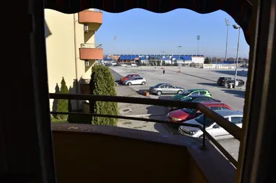 a view of a parking lot from a balcony at MB Apartments in Jagodina