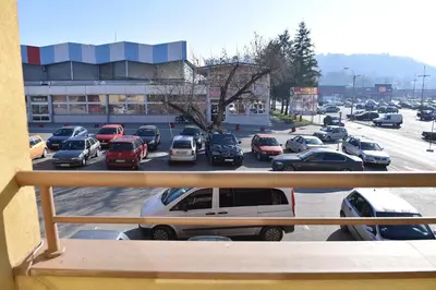 a view of a parking lot with cars parked at MB Apartments in Jagodina