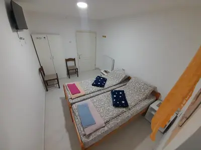 an overhead view of a room with a bed and chairs at Guest House Vila Banjica in Pirot