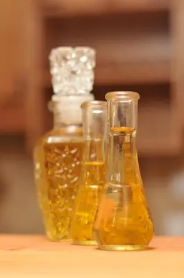 three bottles of honey sitting on a table at Apartment Snow Garden in Kopaonik