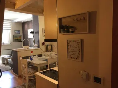 a kitchen with a sink and a table at Apartment Marija- Kopaonik centar in Kopaonik