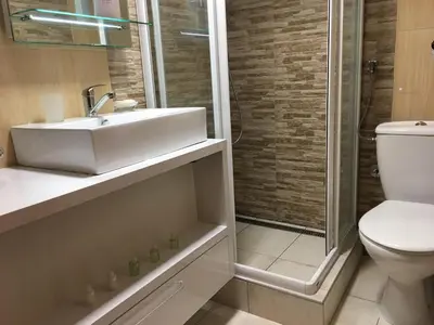 a bathroom with a toilet and a sink and a shower at Apartment Marija- Kopaonik centar in Kopaonik