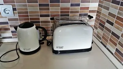 two toasters sitting on a counter next to a toaster at KOP Centar Aviator in Kopaonik