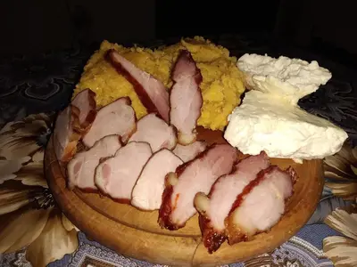 a plate of food with meat on top of cornbread at 
