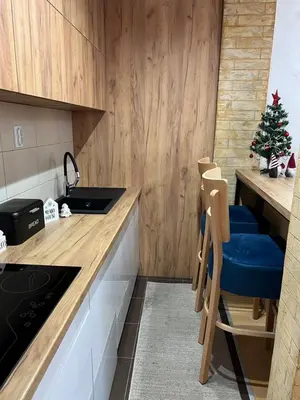 a kitchen with a christmas tree on the counter at Holiday Lux Apartment in Soko Banja