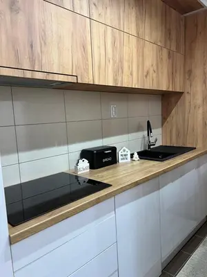 a kitchen with a counter top with a sink at Holiday Lux Apartment in Soko Banja